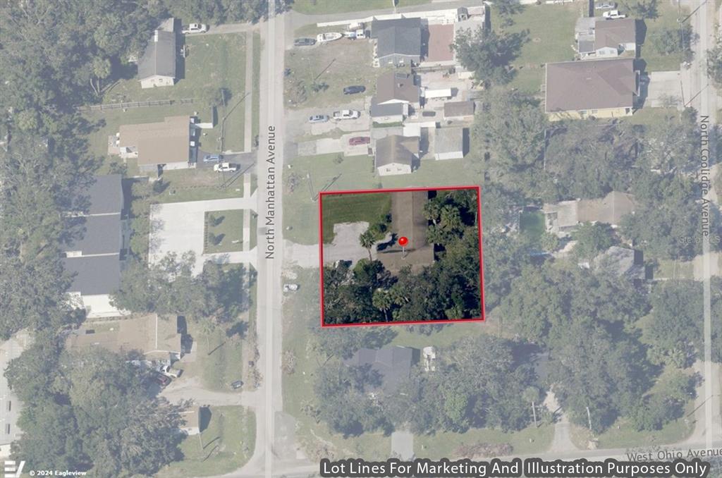 This is an aerial map view showing a residential property lot outlined in red — 4205 N MANHATTAN AVENUE, TAMPA, FL