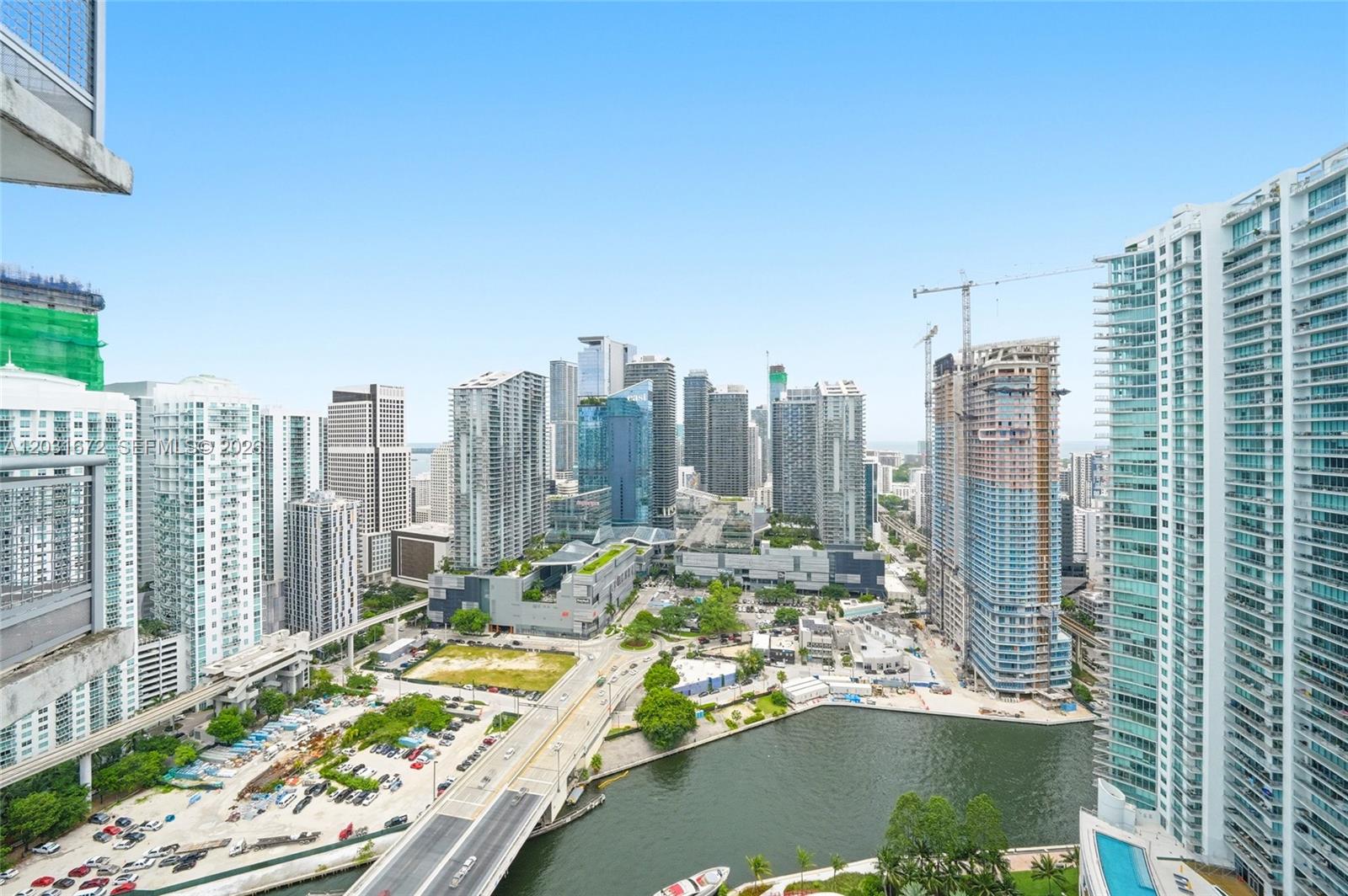 An elevated view of a dense urban skyline with high-rise buildings, a river, and roads — 350 S Miami Ave # 3912, Miami FL 33130, MIAMI, FL