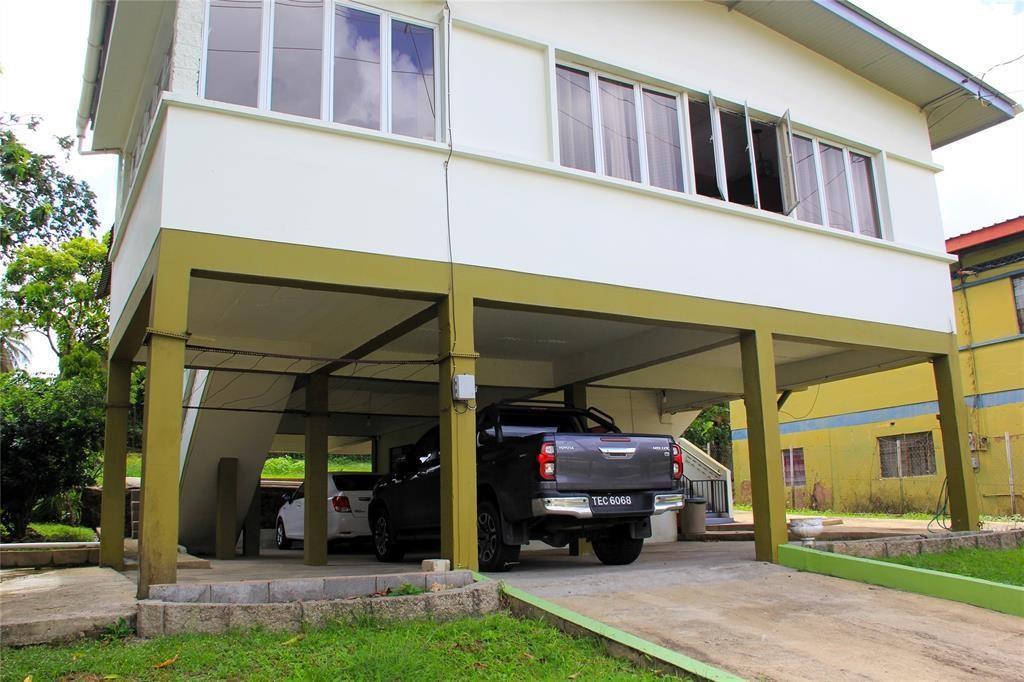 A two-story house with an elevated living area and a covered ground-level parking space — 21 Southern Main Road Duncan Village, FL