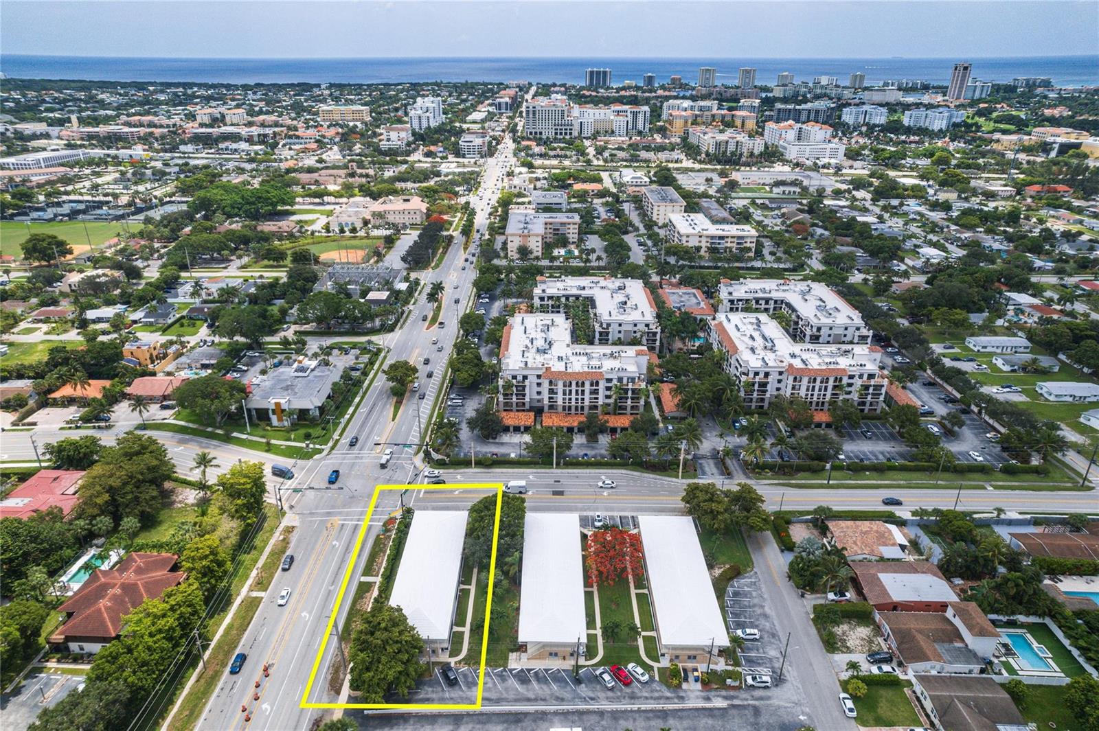 An aerial view shows a low-rise apartment complex with white roofs and parking spaces — 11 SW 4th Avenue # 11, Boca Raton FL 33432, BOCA RATON, FL
