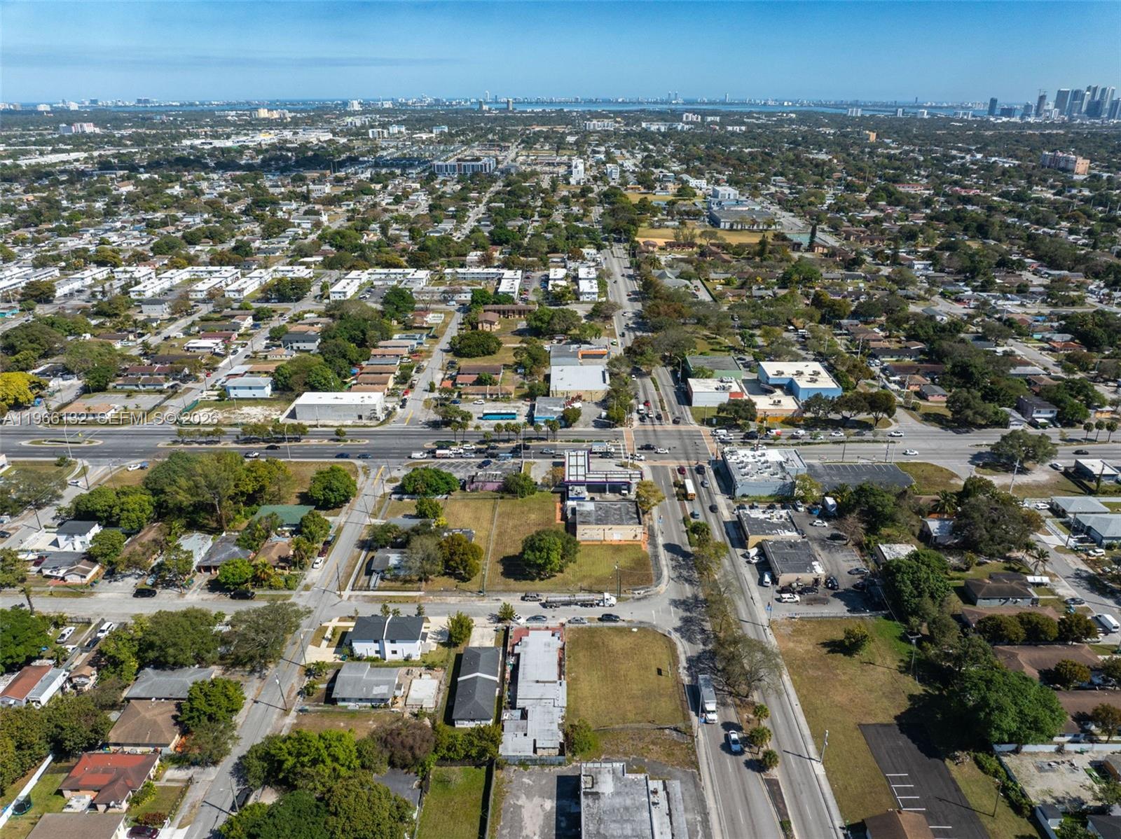 An aerial view shows a suburban intersection surrounded by residential and commercial buildings — 6210 NW 22nd Ave, Miami FL 33147, MIAMI, FL