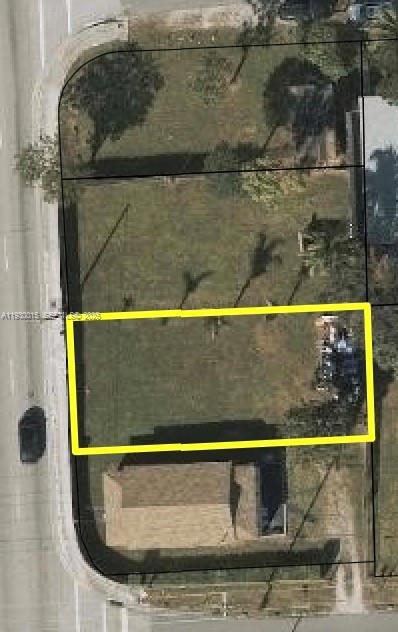 This aerial view shows a residential lot highlighted in yellow with a house nearby — 6971 NW 17th Ave, Miami FL 33147, MIAMI, FL