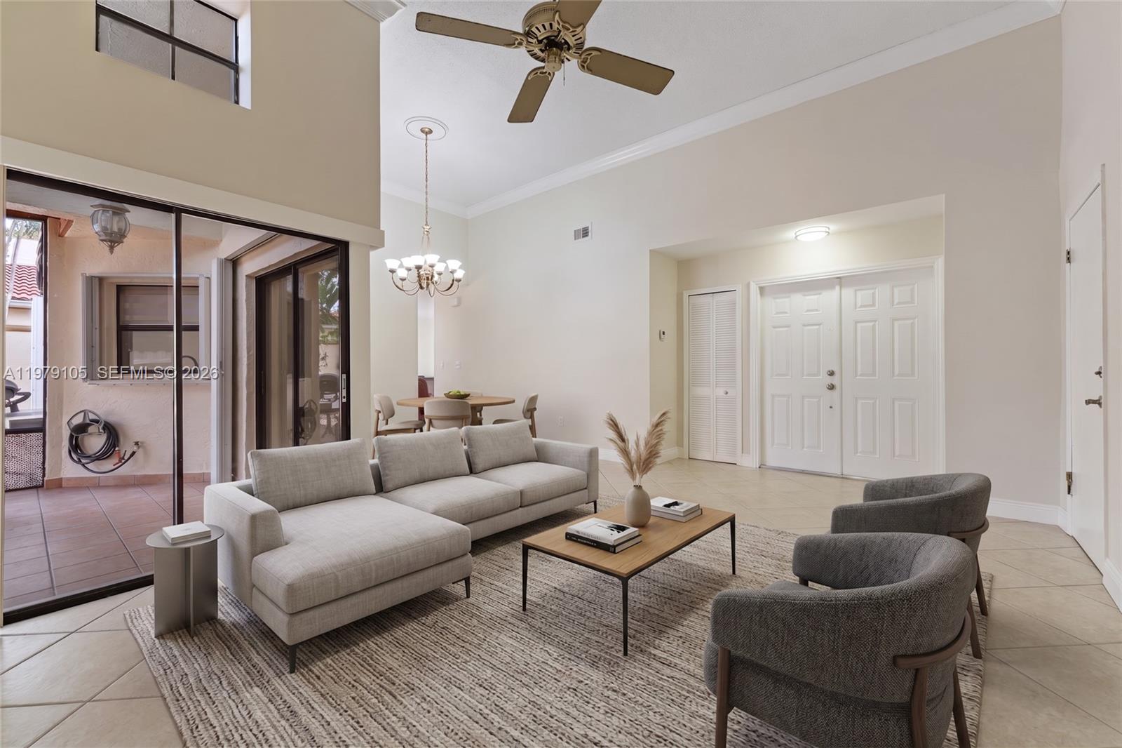 A living room features a sectional sofa, two armchairs, a coffee table, and a dining area — 536 SW 88th Ct, Miami FL 33174, MIAMI, FL