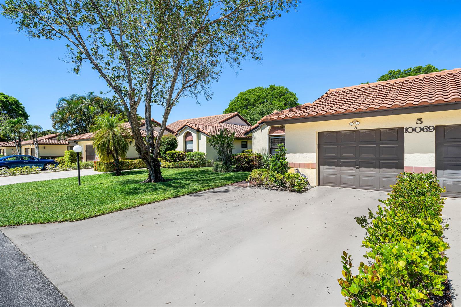 A single-story house with a brown tile roof and a concrete driveway — 10069 Andrea Lane # A, Boynton Beach FL 33437, BOYNTON BEACH, FL