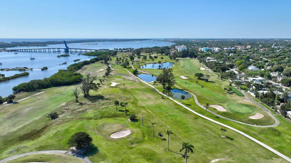 An aerial view of a golf course featuring several ponds, sand traps, and a bridge — 1202 S M Street, FL 33460, FL