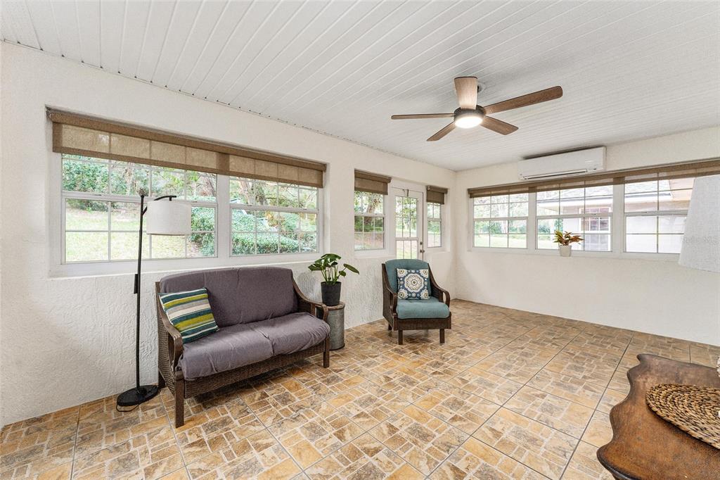 A split-view image showing a laundry room with a washer, dryer, bench, and coat rack — 7237 EDMUND COURT, MOUNT DORA, FL