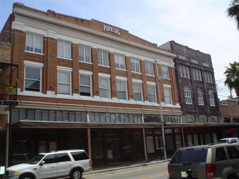 A multi-story brick building with a Kress sign on the facade and street-level storefronts — 1624-1630 E 7TH AVENUE, TAMPA, FL