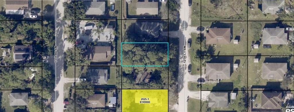 This aerial map shows a vacant residential lot highlighted in yellow among surrounding houses — 1225 12TH COURT SW, VERO BEACH, FL