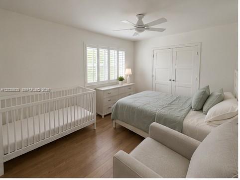 A bedroom features a white crib, a bed, a dresser, and a light-colored armchair — 7880 SW 55th Ave # A, Miami FL 33143, MIAMI, FL
