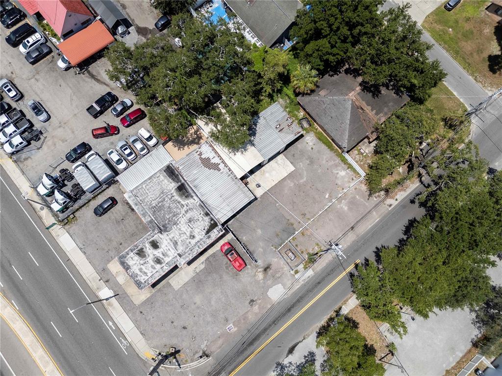 An aerial view shows a commercial property with a paved lot and two buildings — 8624 N FLORIDA AVENUE, TAMPA, FL