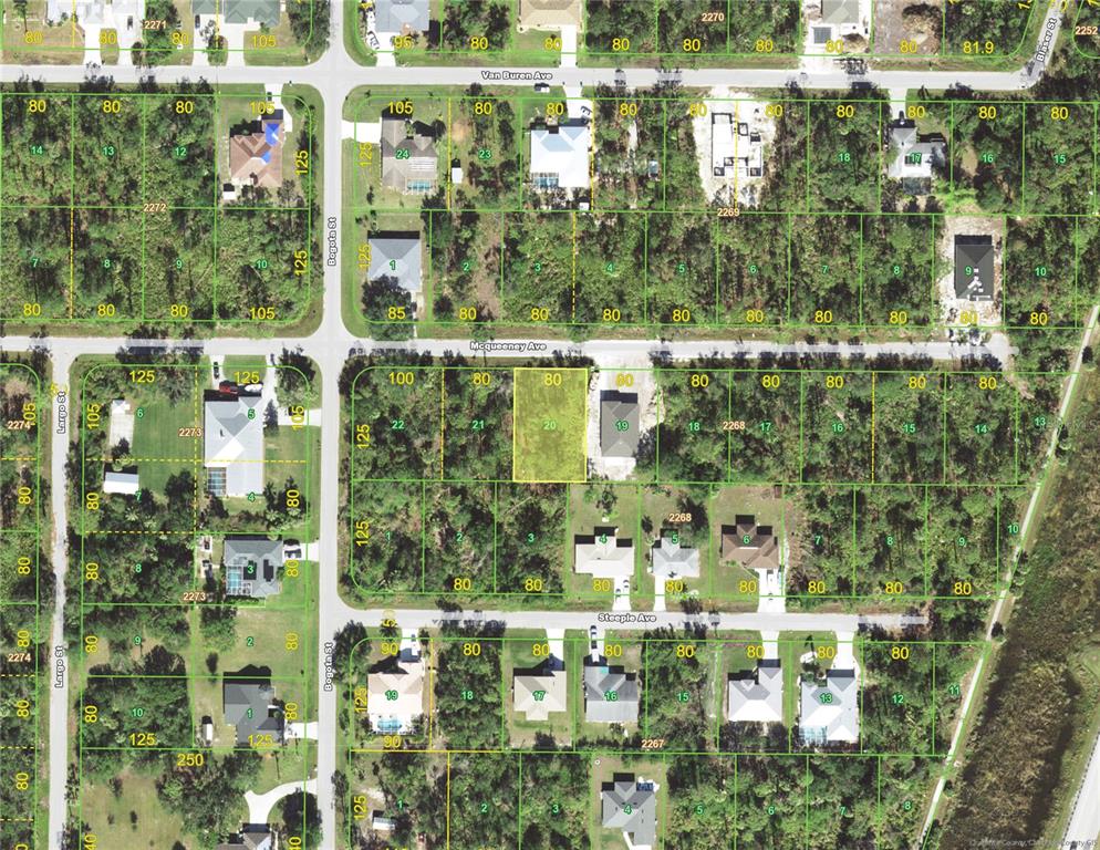 This is an aerial map showing residential lots and street layouts in a neighborhood — 23399 MCQUEENEY AVENUE, PUNTA GORDA, FL