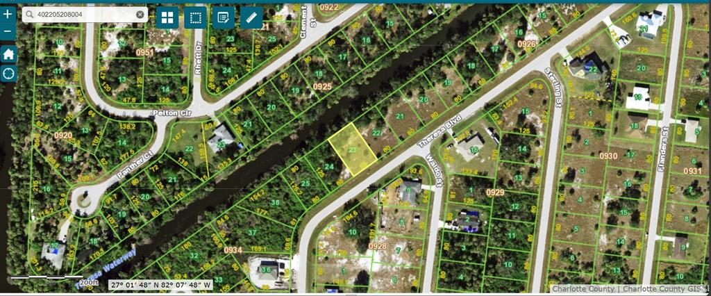 This is a satellite map showing a highlighted vacant residential lot surrounded by wooded land — 177 THERESA BOULEVARD, PORT CHARLOTTE, FL