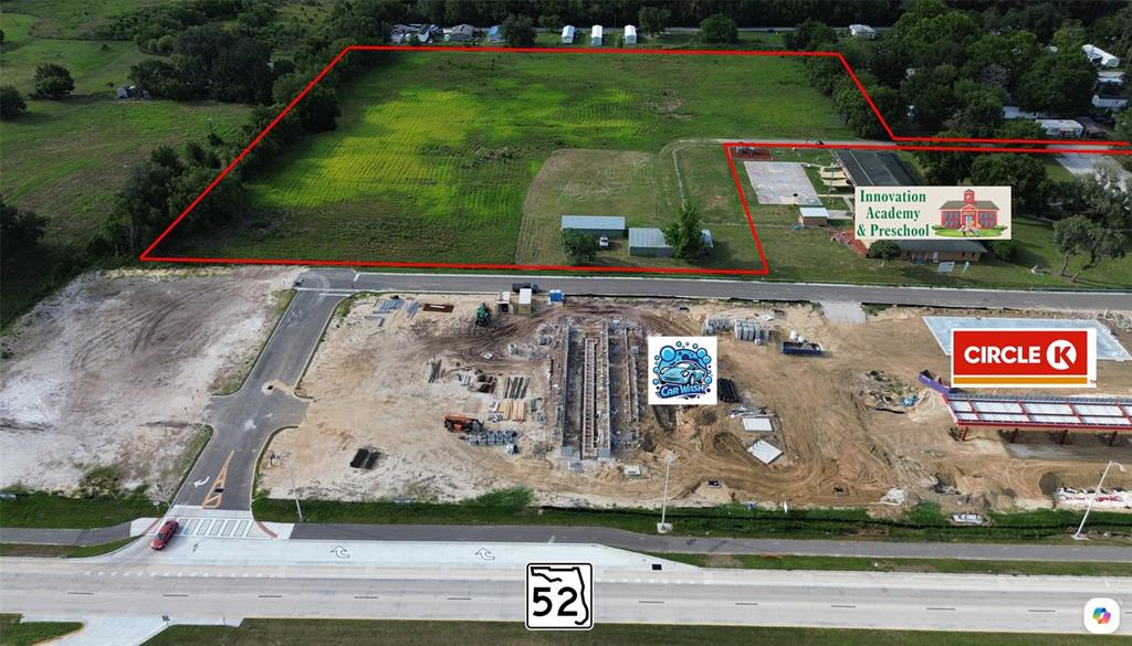 This aerial view shows a construction site with a car wash and Circle K development — 0 BOYS VILLAGE LANE, SAN ANTONIO, FL