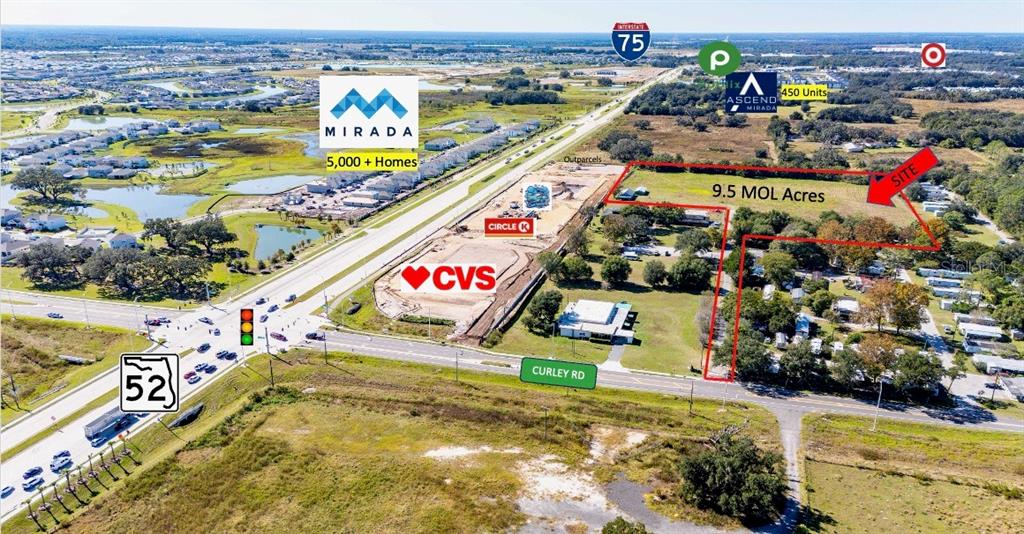This aerial rendering highlights a 9.5-acre development site near a highway intersection and retail businesses — 0 BOYS VILLAGE LANE, SAN ANTONIO, FL