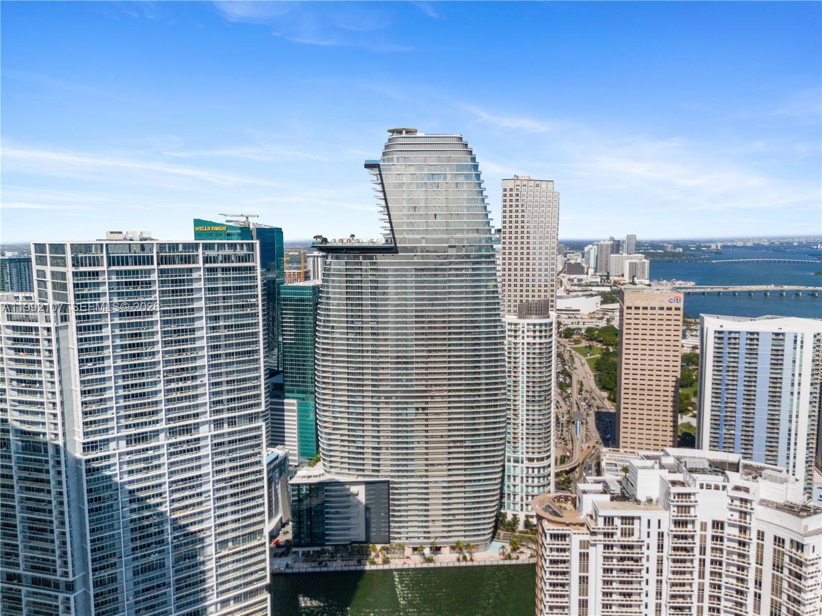 An aerial view of the Miami skyline featuring the distinctive curved silhouette of the Aston Martin Residences — 300 Biscayne Boulevard Way # 2103C, Miami FL 33131, MIAMI, FL