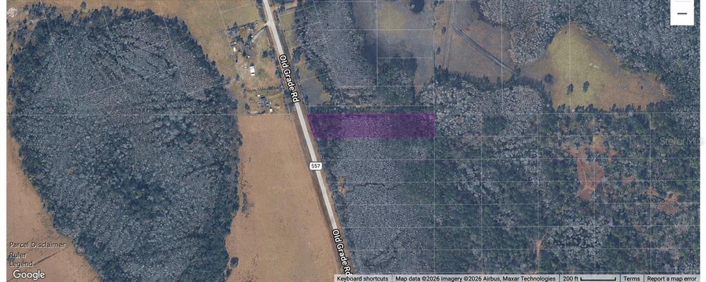 This is an aerial map showing a rectangular purple-highlighted parcel of land along a road — OLD GRADE ROAD, POLK CITY, FL