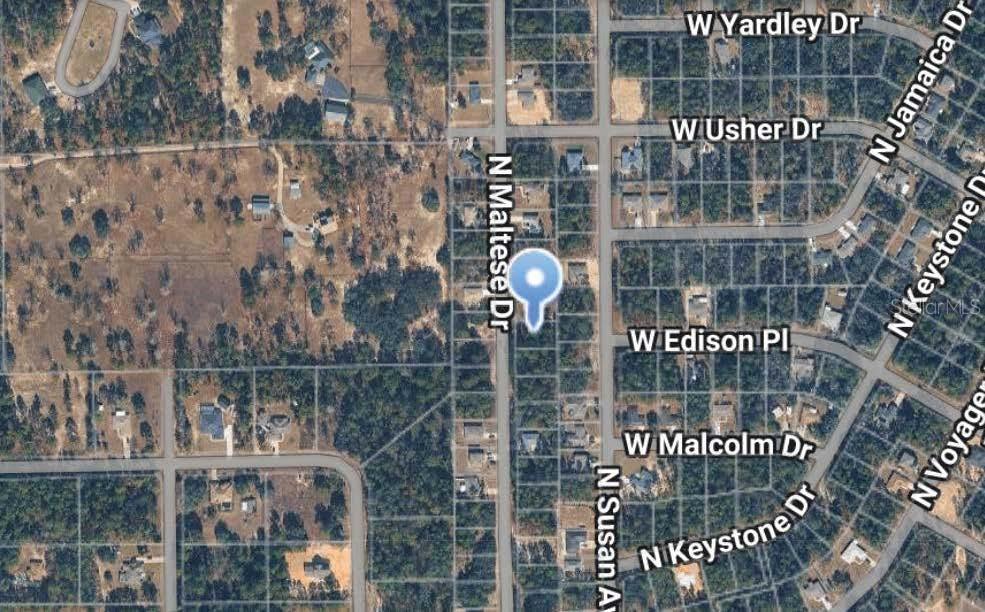 This is an aerial map view of a residential neighborhood with a highlighted property location — 7759 N MALTESE DRIVE, CITRUS SPRINGS, FL