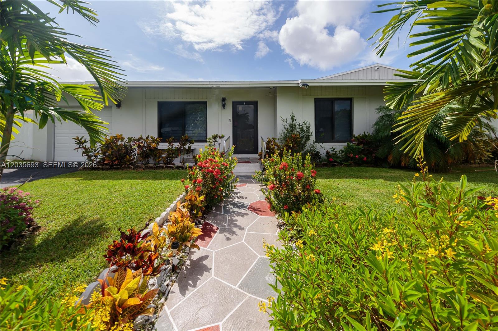 A single-story house features a stone-patterned walkway leading to the front entrance — 19311 Sterling Dr, Cutler Bay FL 33157, CUTLER BAY, FL