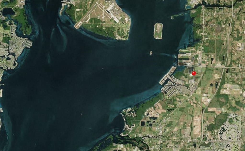 This is an aerial map showing a red pin marking a property location near water — 119 SAINT PIERRES WAY, APOLLO BEACH, FL