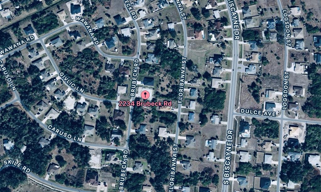 This is an aerial map view of a residential neighborhood with a highlighted property — 2264 BRUBECK ROAD, NORTH PORT, FL