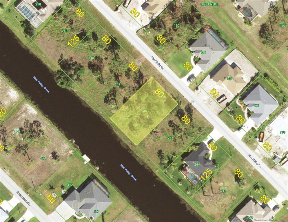 This is an aerial map showing a highlighted vacant residential lot along a canal — 50 PINE VALLEY LANE, ROTONDA WEST, FL