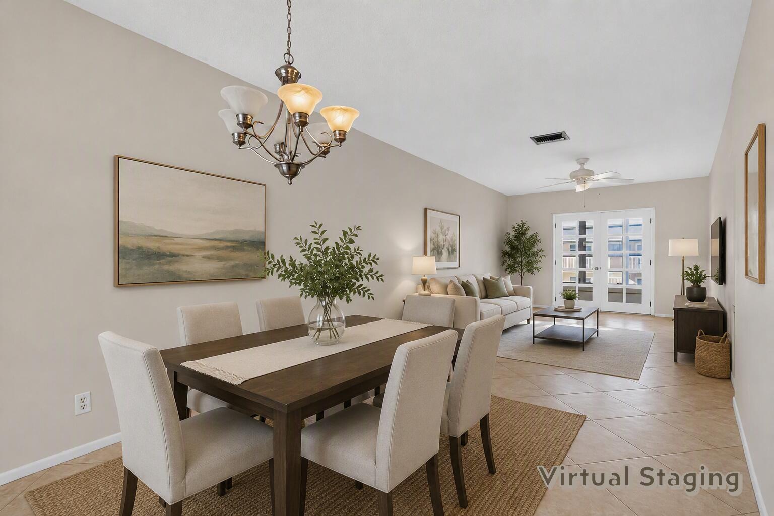 A virtually staged open-concept dining and living area with tile floors and a chandelier — 2182 NE 1st Way # 202, Boynton Beach FL 33435, BOYNTON BEACH, FL