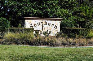 A stone monument sign for Southern Woods stands in front of trees and landscaping — 3 Peachwood Point, FL 34446, FL