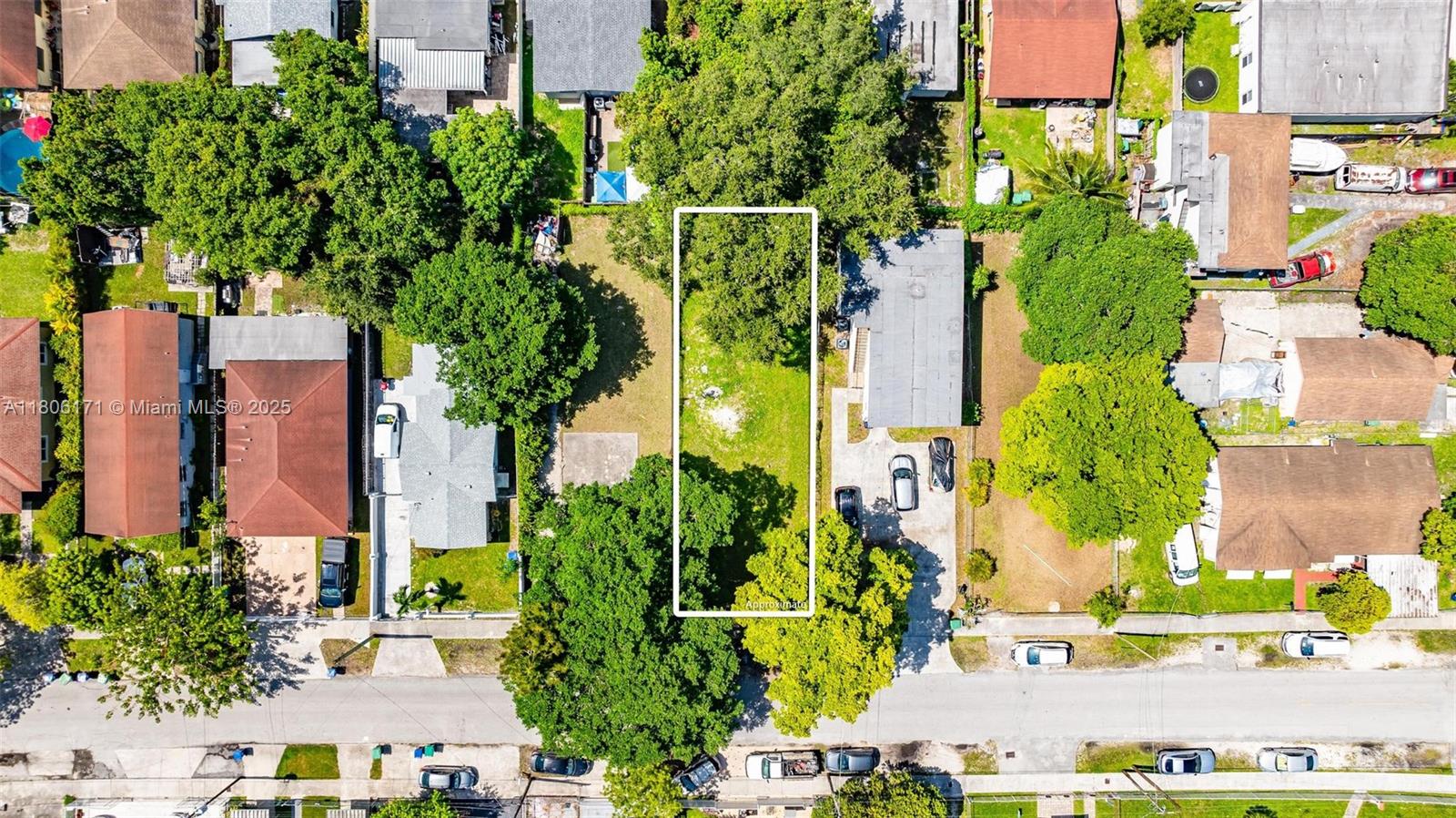 An aerial view shows a rectangular vacant lot outlined in white between two residential properties — 2133 nw 48th st, Miami FL 33142, MIAMI, FL