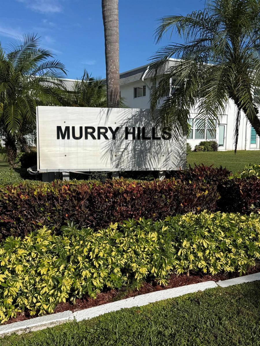 A sign reading Murry Hills stands in front of a white building and palm trees — 2960 Lake Osborne Drive # 209, FL 33461, FL