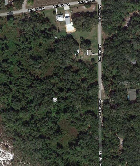 This is an aerial map view of a wooded lot located at a street intersection — 1510 SWEET GUM STREET, LAKE PLACID, FL