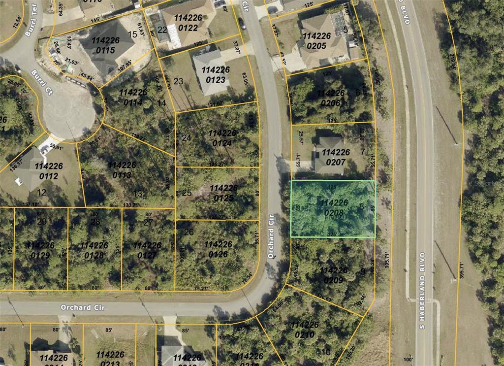 This is a satellite map showing residential property lot lines and parcel numbers — ORCHARD CIRCLE, NORTH PORT, FL