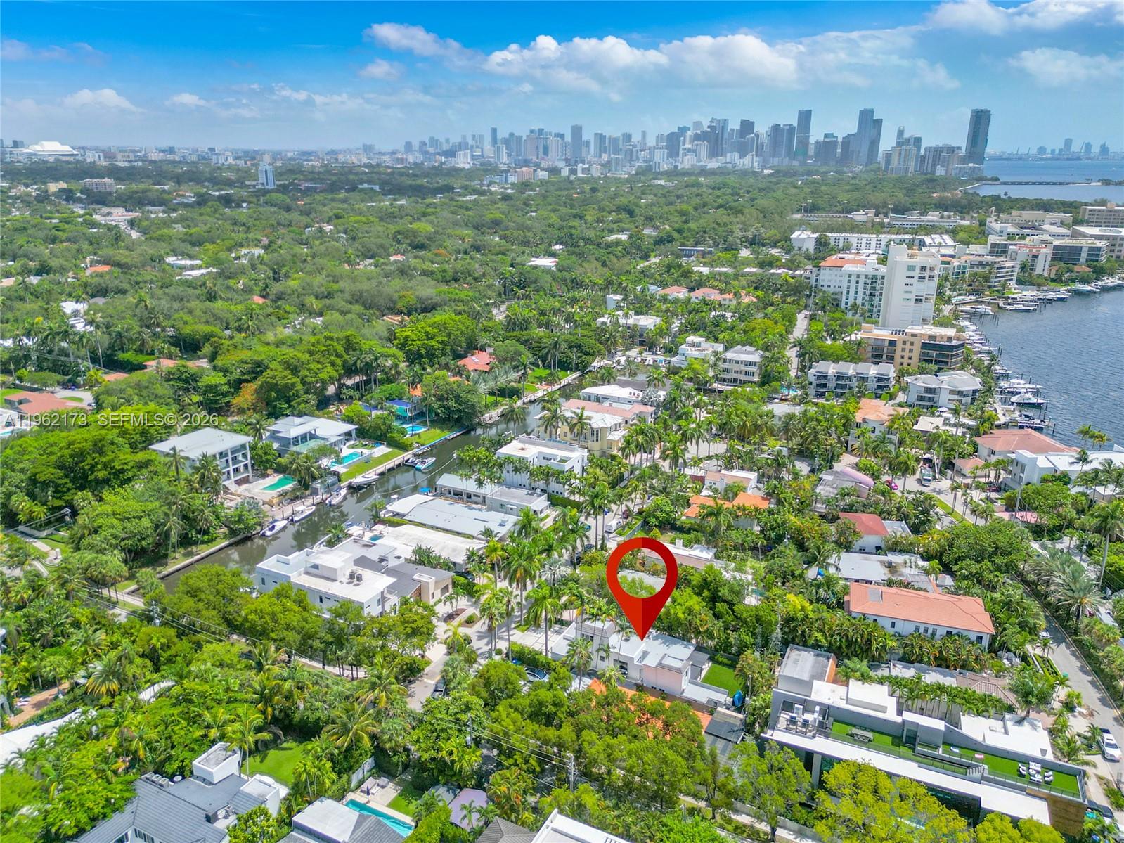 An aerial view shows a residential neighborhood with a red location pin over a house — 1826 Fairhaven Pl, Miami FL 33133, MIAMI, FL