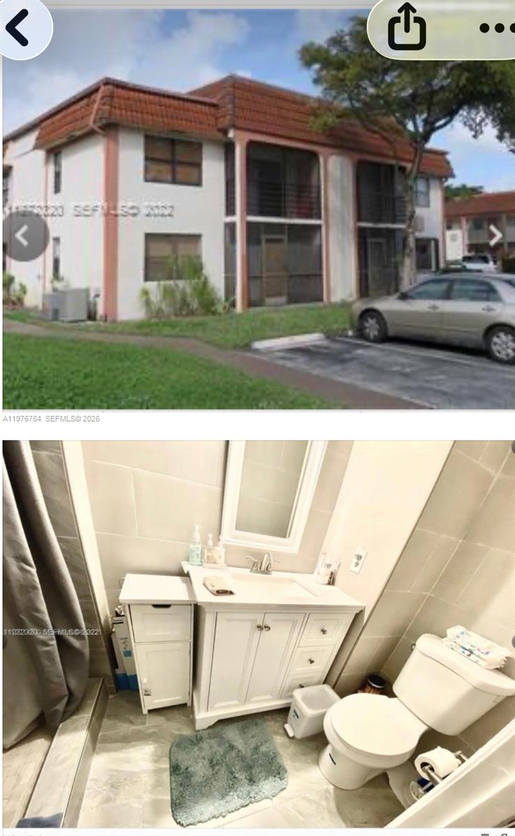 A white entry door with a security chain and deadbolt sits at the end of a tiled hallway — 851 NE 207th Ter # 103, Miami FL 33179, MIAMI, FL