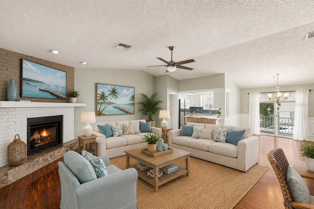 A long, covered wooden deck with a white lattice railing overlooks a neighboring yard — 4941 CARDINAL TRAIL, PALM HARBOR, FL