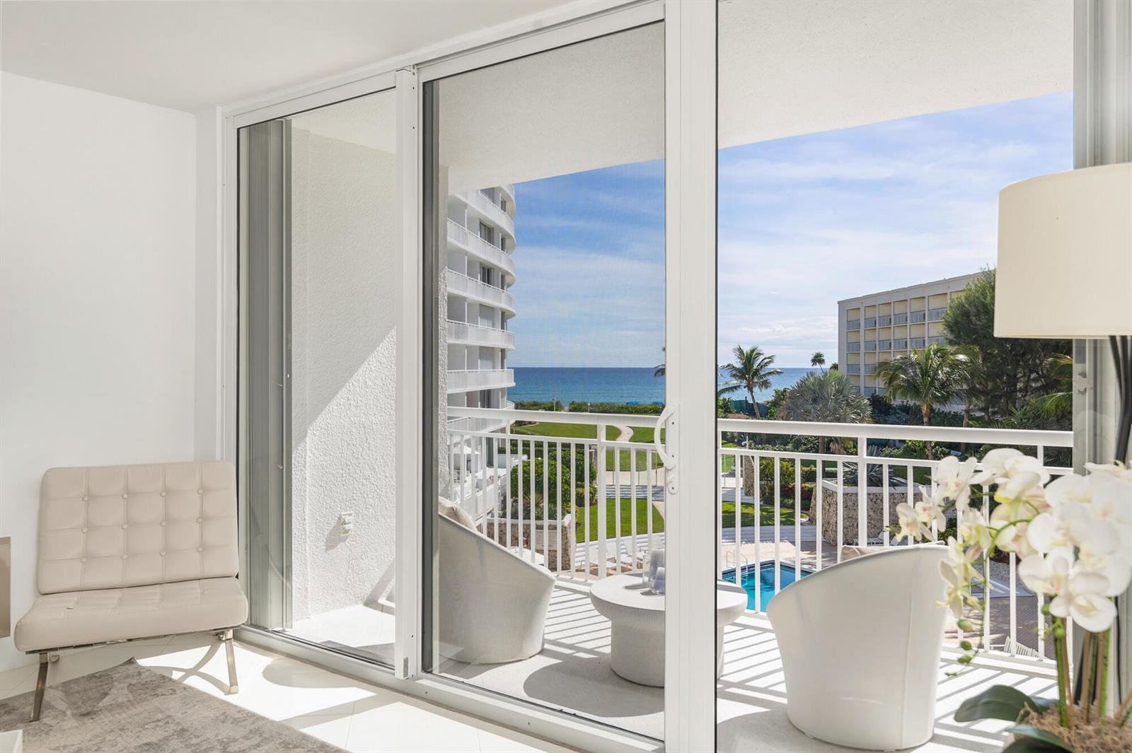 A bright room with a sliding glass door opening to a balcony overlooking the ocean — 2780 S Ocean Boulevard # 311, Palm Beach FL 33480, PALM BEACH, FL