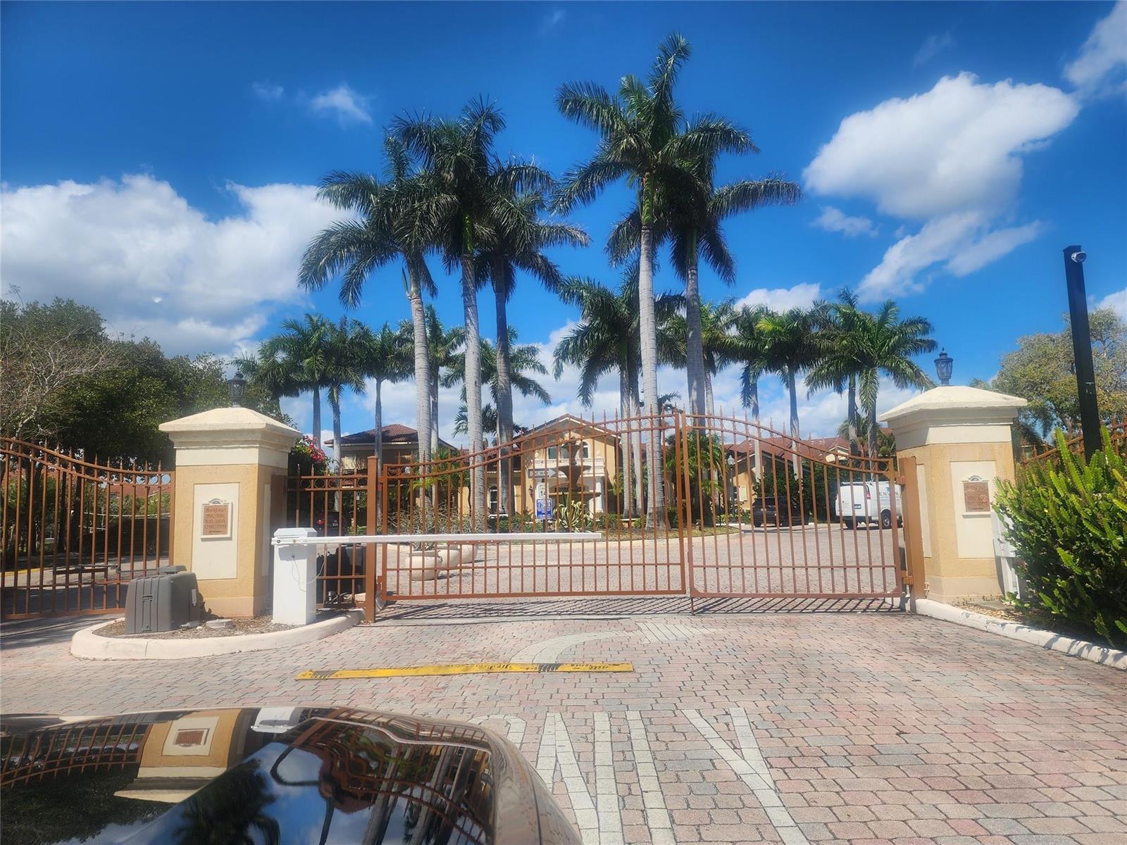 A dark blue entry door with a silver peephole and two locks is labeled 317 — 317 Villa Circle # 317, Boynton Beach FL 33435, BOYNTON BEACH, FL