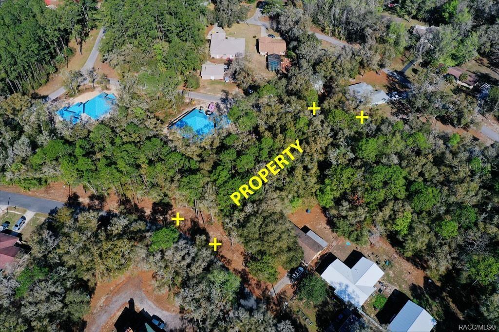 An aerial view shows a wooded residential lot marked with yellow plus signs — 2663 W CYPRESS DRIVE, DUNNELLON, FL