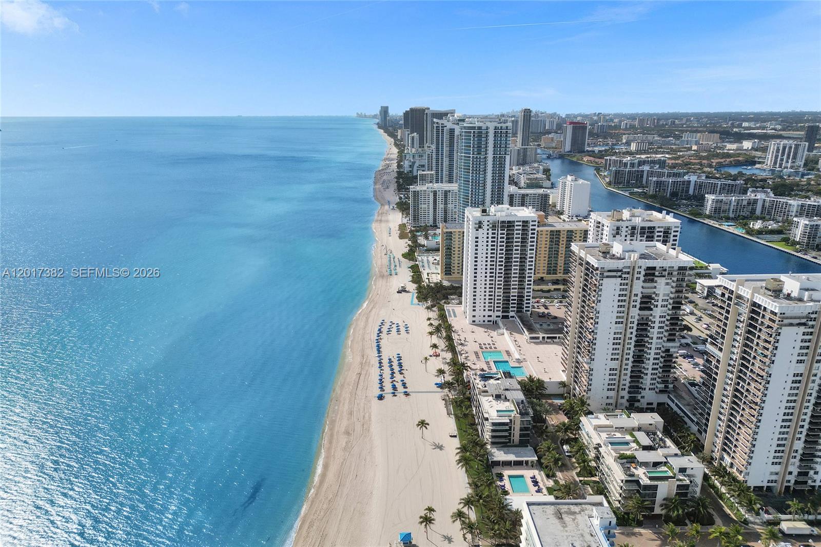 An aerial view shows a sandy beach along the ocean next to high-rise buildings — 1600 S Ocean Dr # 16B, Hollywood FL 33019, HOLLYWOOD, FL
