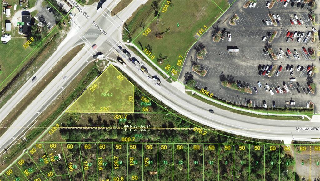 This is an aerial map showing a vacant triangular lot adjacent to a paved road — 5682 DUNCAN ROAD, PUNTA GORDA, FL