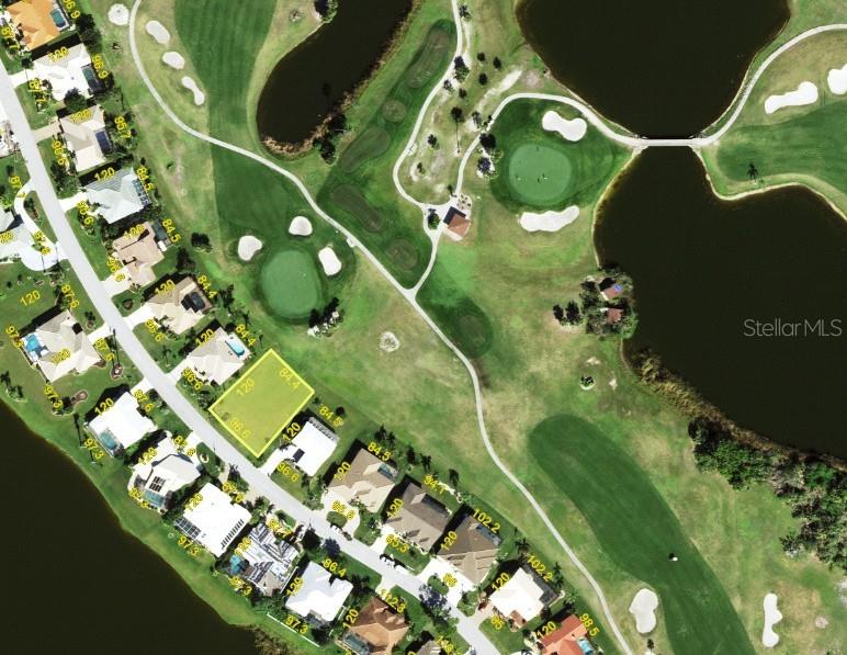This is an aerial map showing a vacant residential lot highlighted in yellow on a golf course — 3800 BORDEAUX DRIVE, PUNTA GORDA, FL