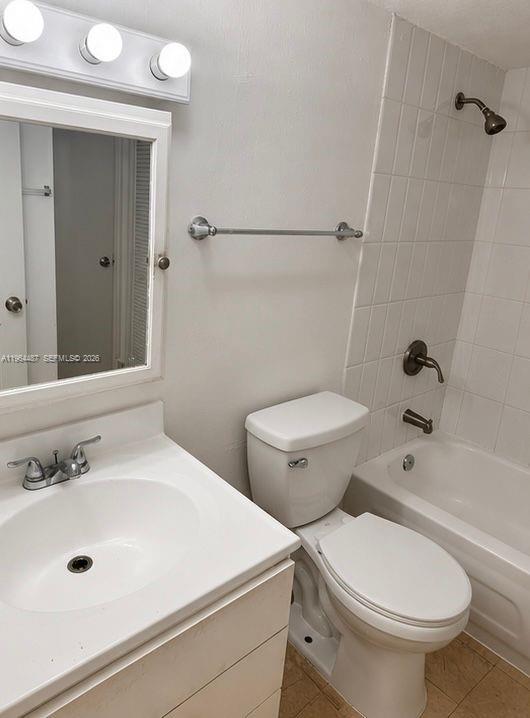 A bathroom features a white vanity, a toilet, and a shower-tub combination with white tiles — 4721 NW 7th St # 12, Miami FL 33126, MIAMI, FL