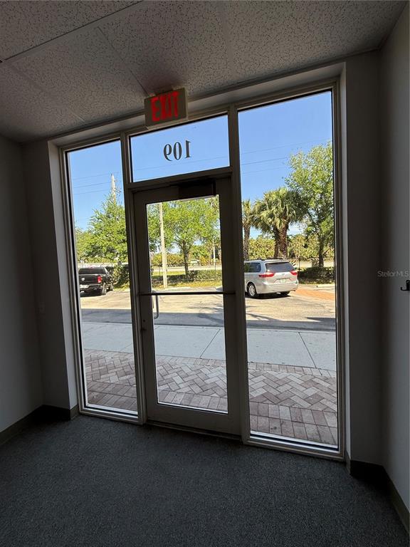 An interior view of a commercial office entrance with a glass door and side windows — 1000 STINSON WAY, WEST PALM BEACH, FL