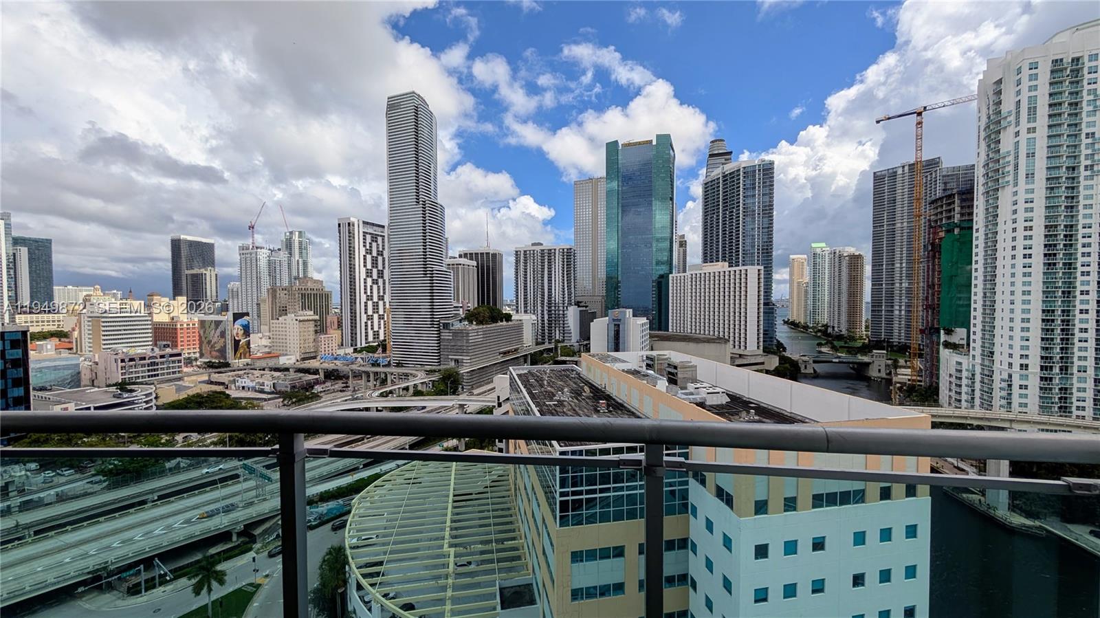 A high-angle view of the Miami skyline featuring skyscrapers, highway overpasses, and a river — 350 S Miami Ave # 1901, Miami FL 33130, MIAMI, FL