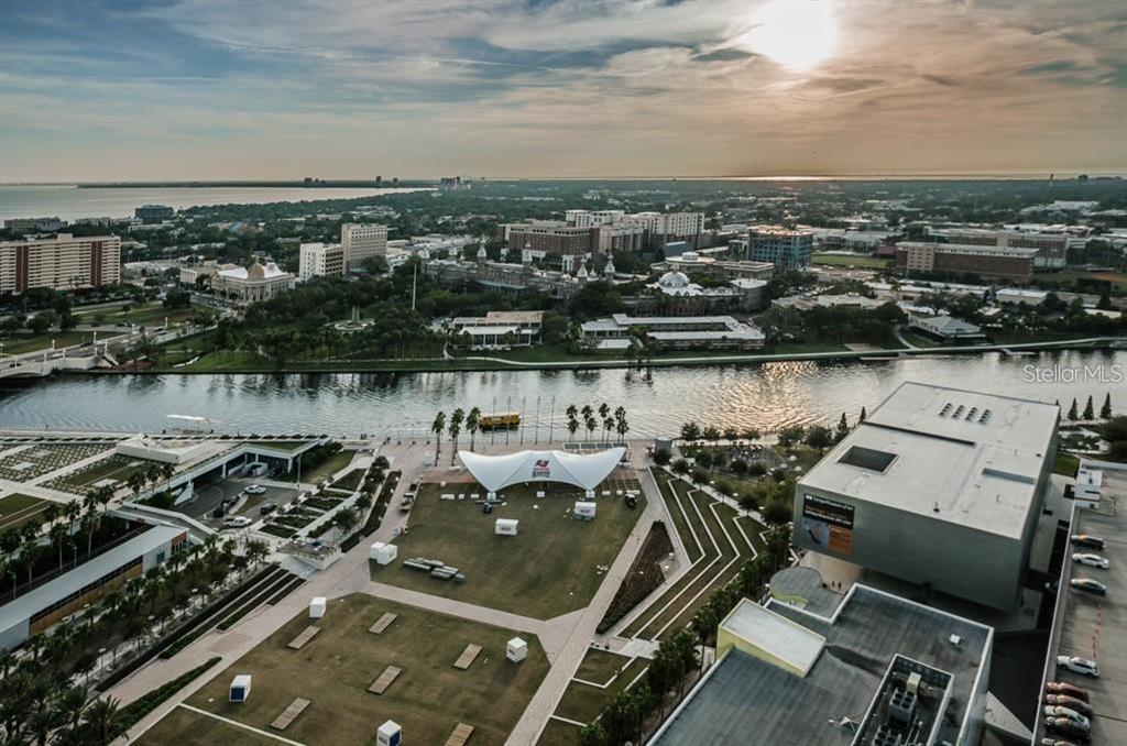 Aerial view of a park, river, and city skyline at sunset in Tampa, Florida — 777 N ASHLEY DRIVE UNIT 2403, TAMPA, FL