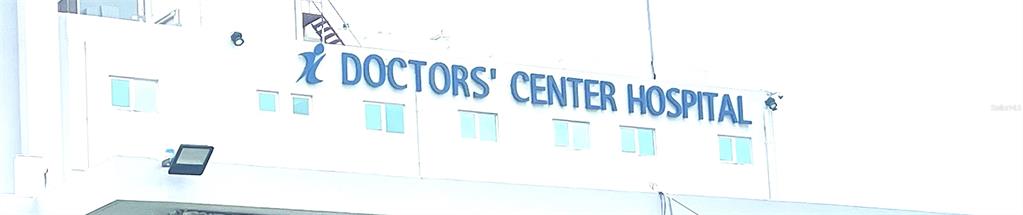 The exterior of a building features a sign reading Doctors' Center Hospital — 757 HIPODROMO, SAN JUAN, PR