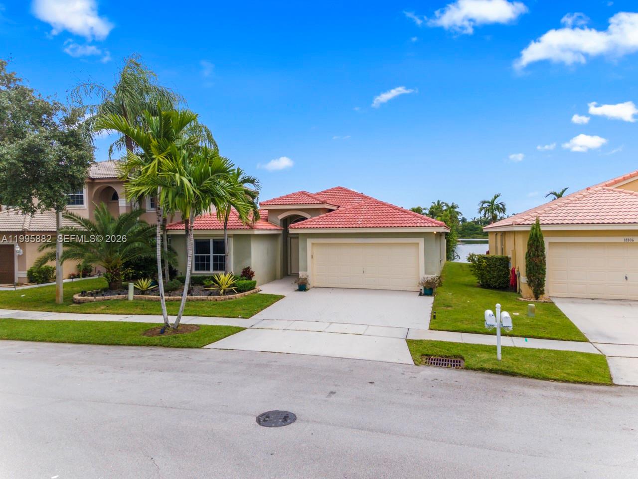 A single-story house with a red tile roof and a two-car garage — 18096 SW 29th St, Miramar FL 33029, MIRAMAR, FL