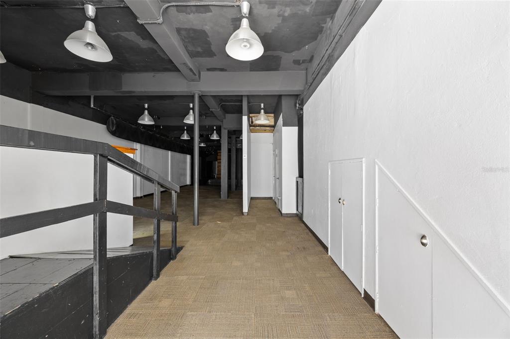 An interior view of a commercial space with a dark ceiling, carpeted floor, and ramp — 322 MENDEZ VIGO, DORADO, PR