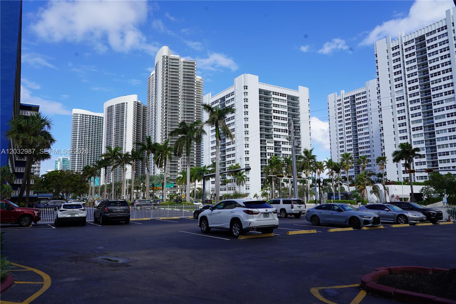 A parking lot sits in front of several tall white residential high-rise buildings — 1913 S Ocean Dr # 405, Hallandale Beach FL 33009, HALLANDALE BEACH, FL