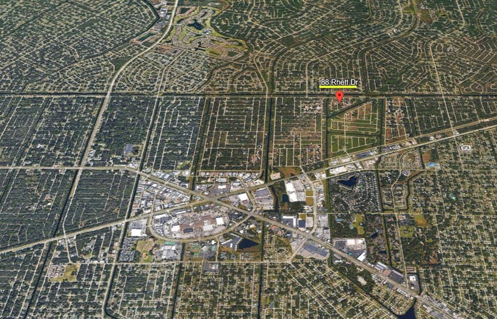 This is an aerial map view showing a residential neighborhood and surrounding commercial areas — 88 RHETT DRIVE, PORT CHARLOTTE, FL