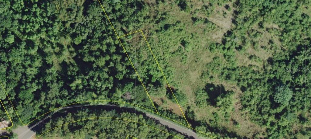 An aerial view shows a plot of land outlined in yellow next to a road — SR 311 KM. 5.3, GUANAJIBO WARD, CABO ROJO, PR